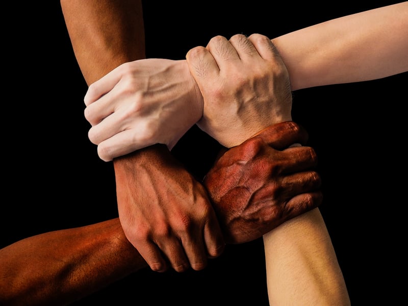 Friends holding hands